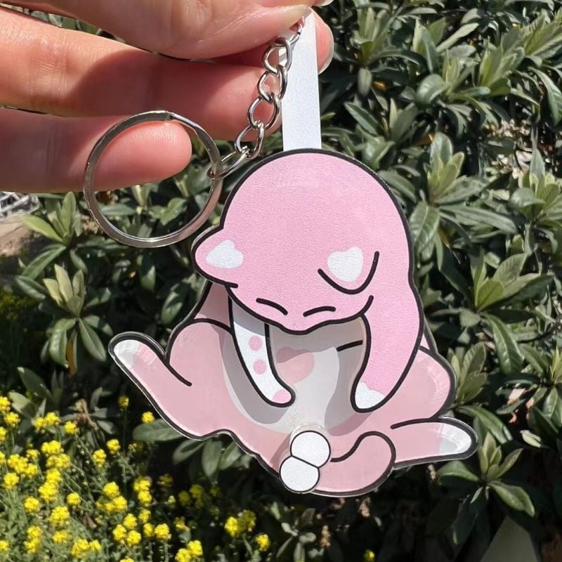 Playing with eggs and kitten keychain